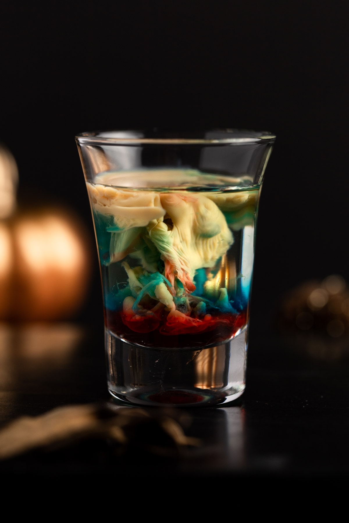 Alien brain hemorrhage shot with mixed red and blue colors, on a black background.