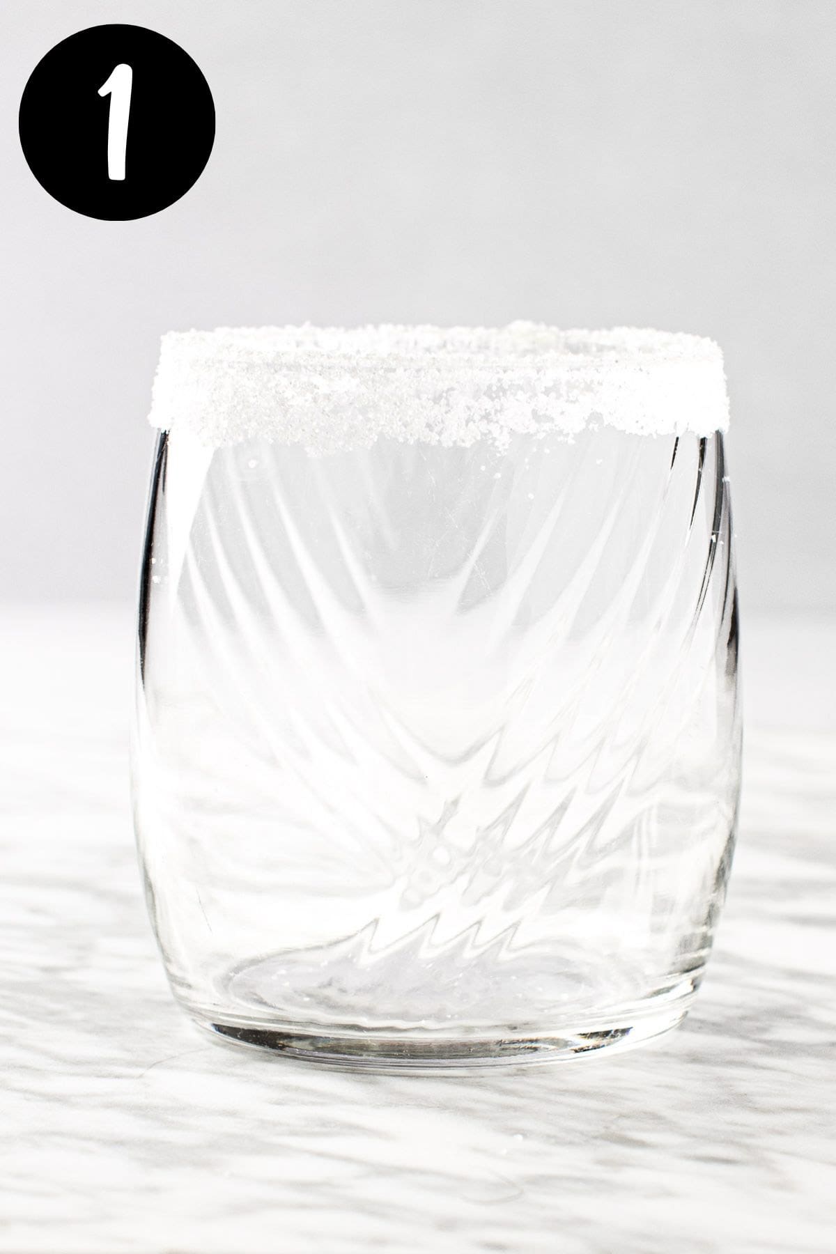 A margarita glass with salt around the rim.