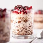 Up close view of a glass of chocolate pomegranate overnight oats