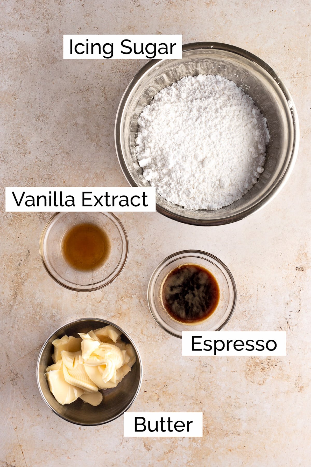 Overhead view of the ingredients needed to make espresso buttercream frosting.