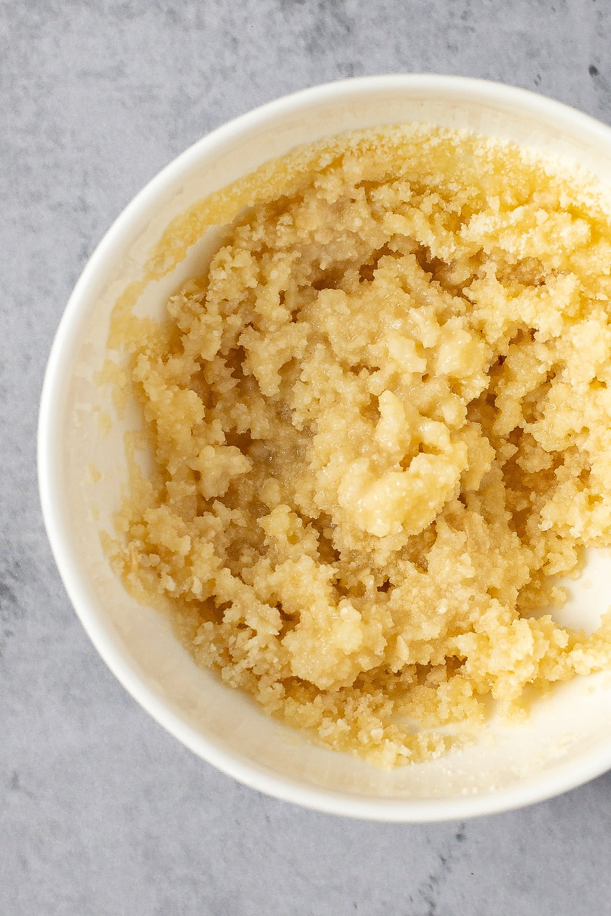 Breadcrumb topping mixed together in a small white bowl.