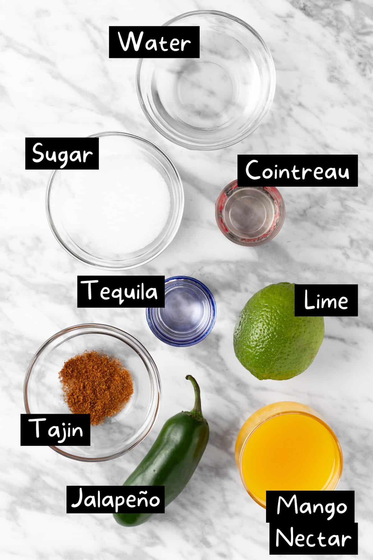 The ingredients to make the mango jalapeño margarita.