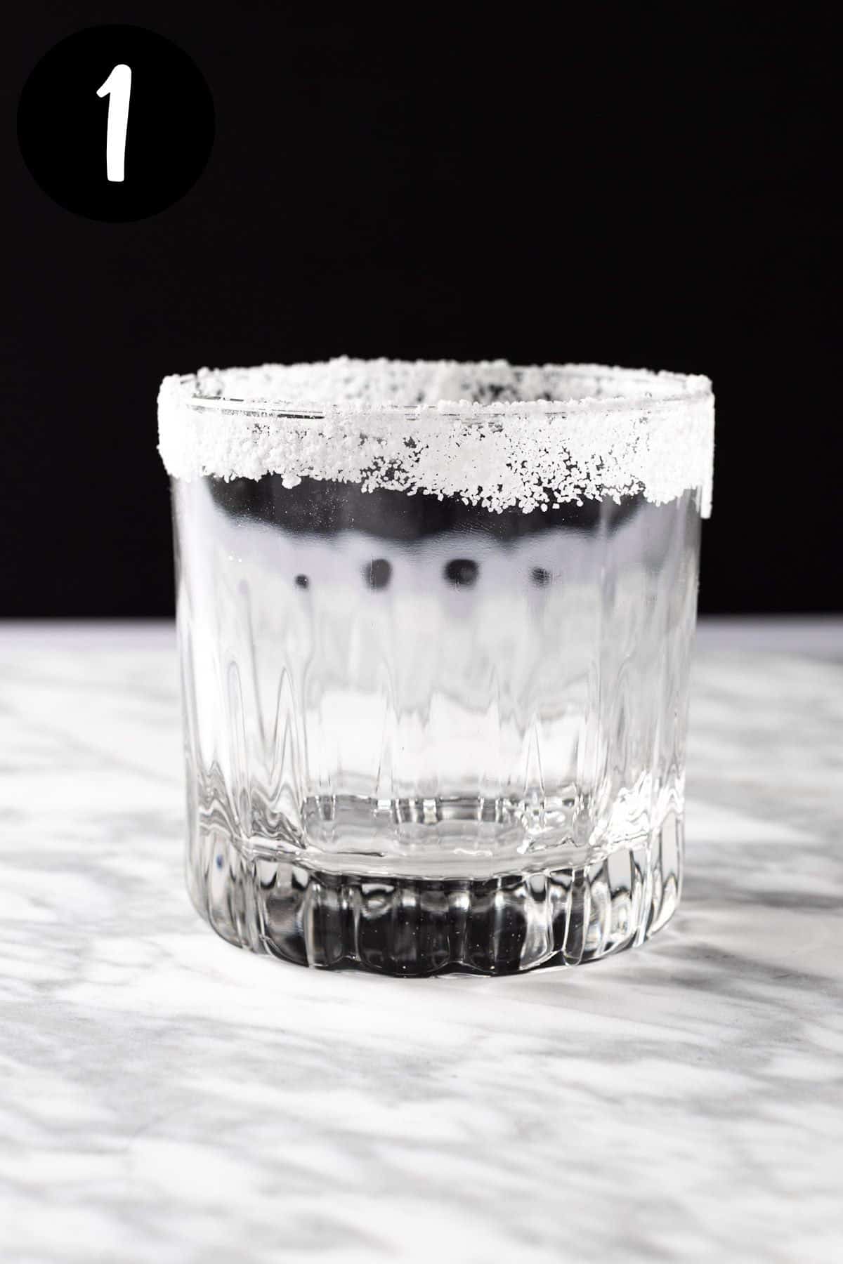 A cocktail glass with a sugar rim.