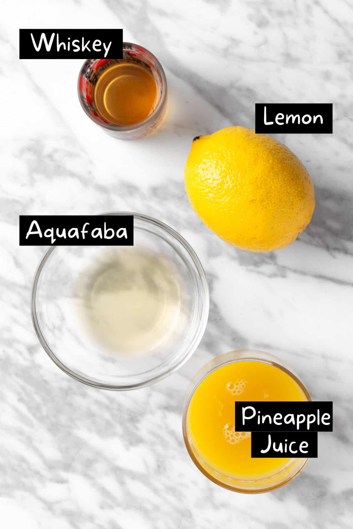 The ingredients needed to make the pineapple whiskey sour.