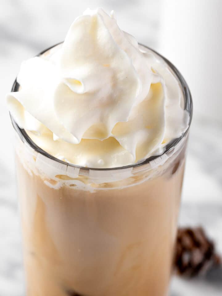 A Starbucks iced white chocolate mocha topped with whipped cream.