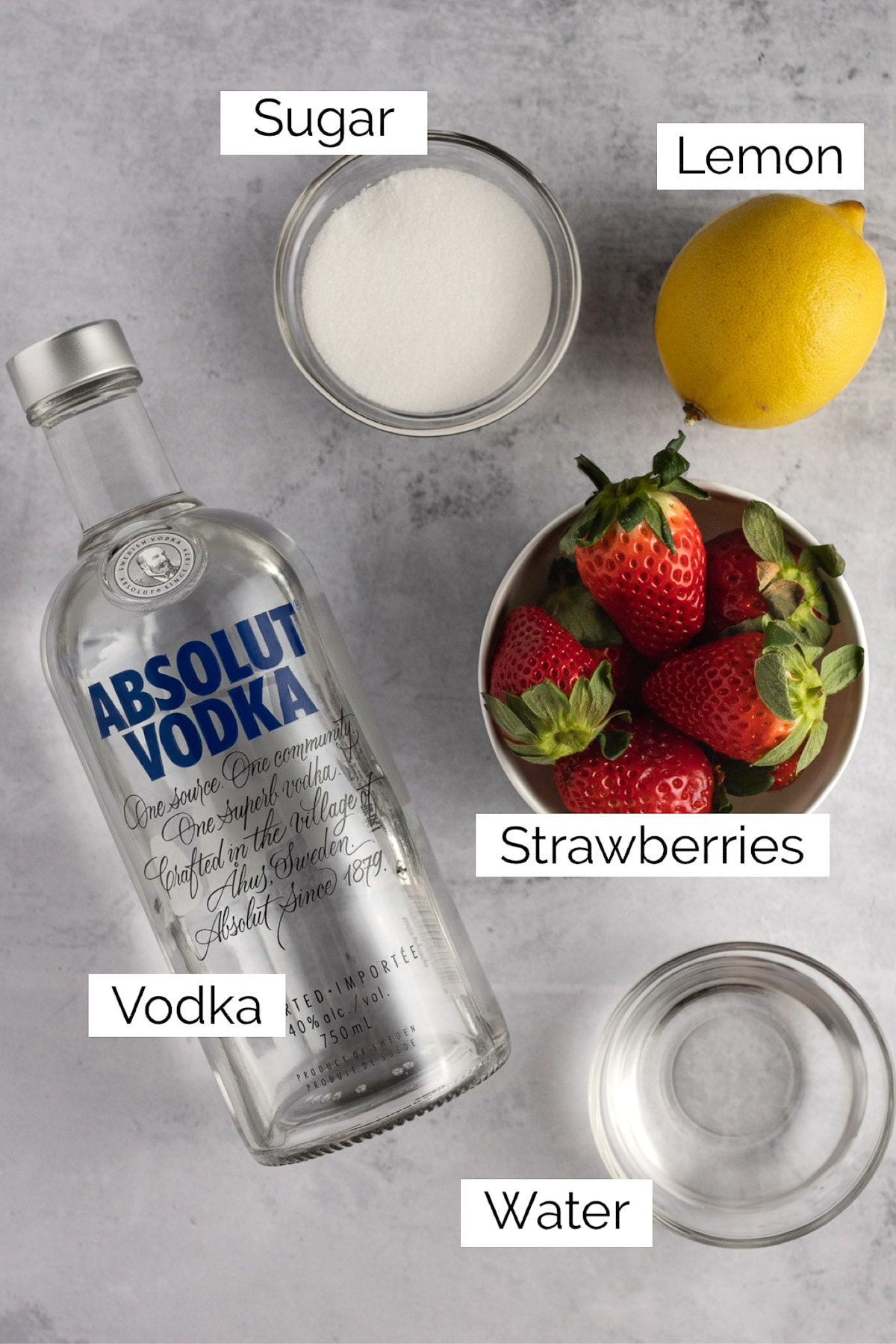 Overhead view of the ingredients needed to make the strawberry martini.