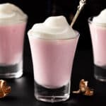 Tequila rose pudding shots topped with whipped cream.